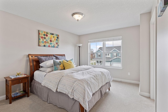 231 Prairie Way N, Bayport, MN 55003 - carpeted bedroom featuring a textured ceiling and baseboards