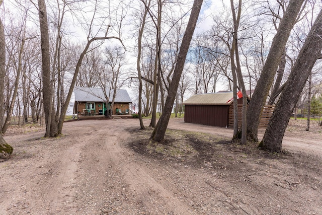 39315 Little Mo Rd, Clitherall Twp, MN 56524 - view of front of property featuring an outdoor structure and dirt driveway