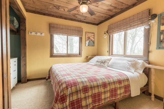 39315 Little Mo Rd, Clitherall Twp, MN 56524 - bedroom with carpet floors, baseboards, multiple windows, and wooden ceiling
