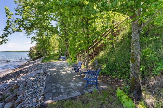 39315 Little Mo Rd, Clitherall Twp, MN 56524 - view of patio / terrace featuring a water view and stairs
