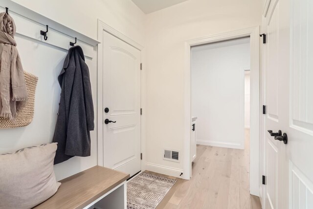 4501 Overlook Dr, Bloomington, MN 55437 - mudroom featuring baseboards, visible vents, and light wood-style flooring