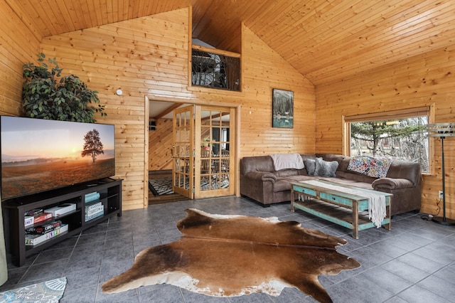 living room featuring wood ceiling, wood walls, tile patterned floors, and high vaulted ceiling
