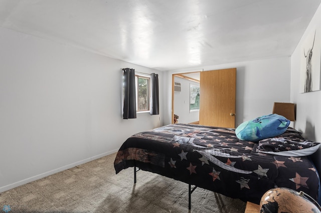 bedroom with baseboards and carpet flooring