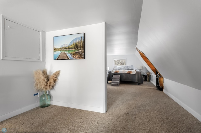 hall with carpet and baseboards