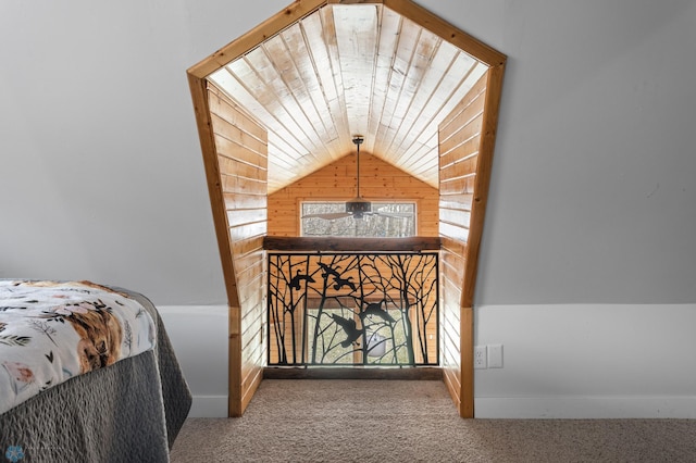 bedroom featuring vaulted ceiling, carpet floors, and baseboards