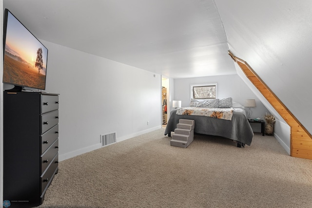 carpeted bedroom with visible vents and baseboards