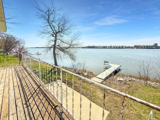 exterior space featuring a dock and a water view
