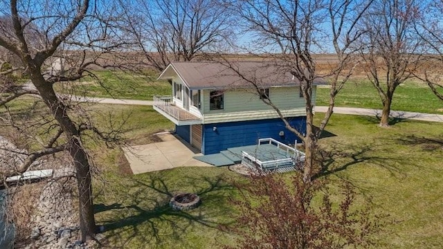 view of home's exterior with a lawn