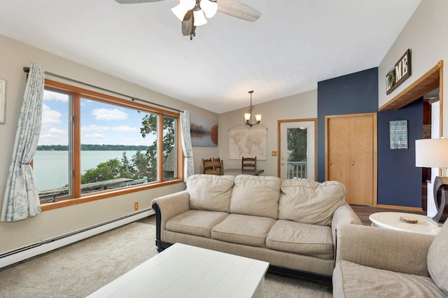 living room with a baseboard heating unit, a water view, vaulted ceiling, ceiling fan with notable chandelier, and wood finished floors