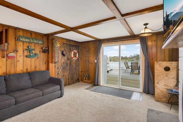 carpeted living area with beamed ceiling, wooden walls, and coffered ceiling