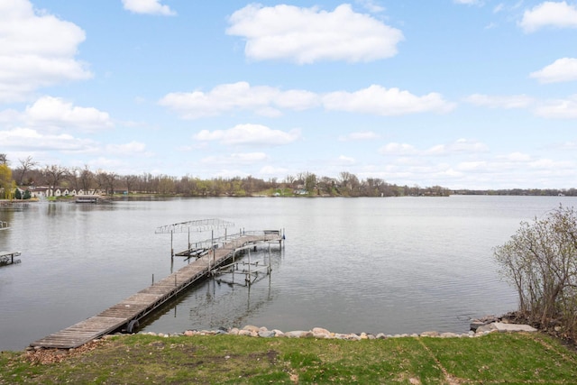 dock area with a water view and boat lift