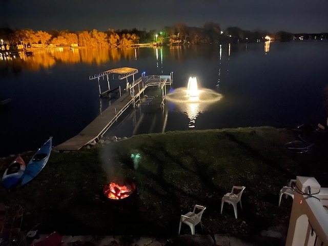 exterior space with a boat dock and a water view