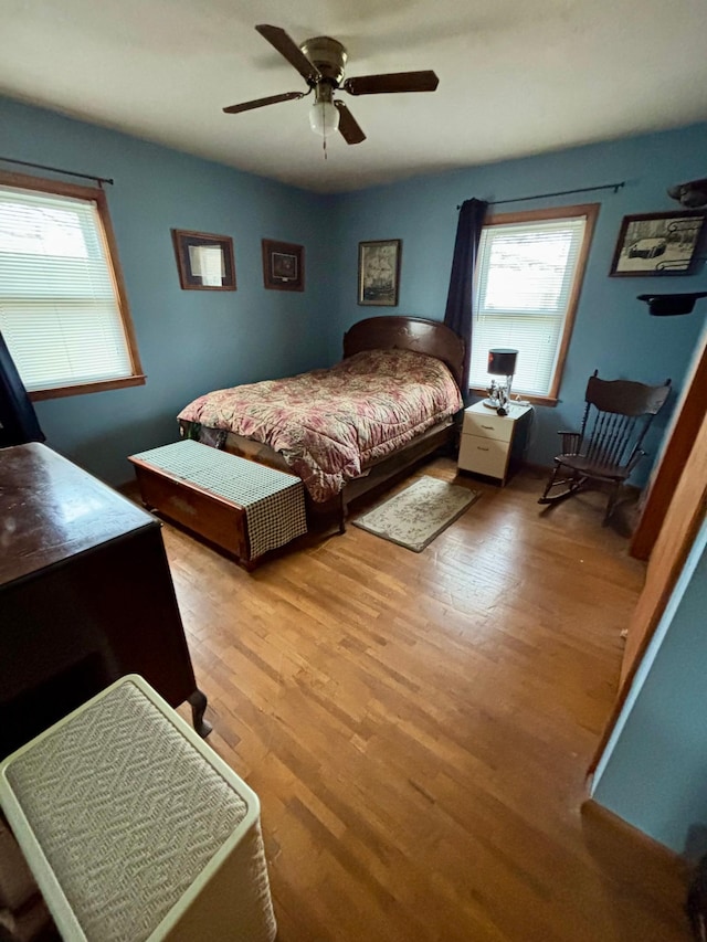 bedroom with ceiling fan and wood finished floors
