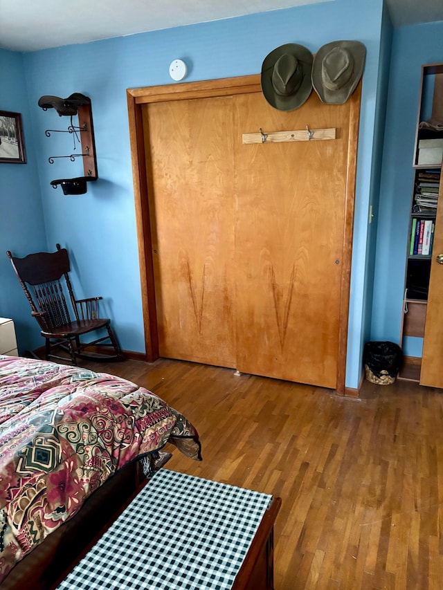 bedroom featuring a closet and wood finished floors