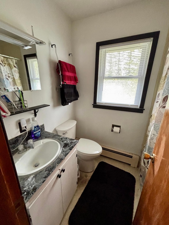 bathroom with vanity, baseboard heating, a shower with curtain, and toilet