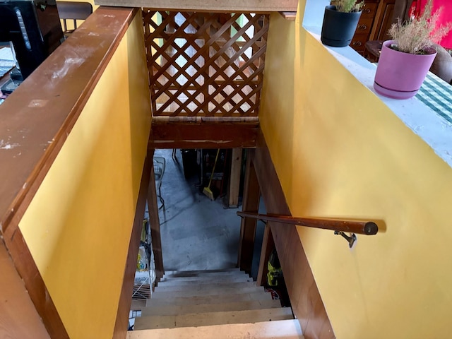 stairway featuring concrete floors