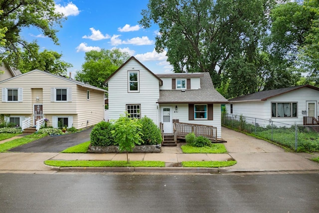 451 Taylor St NE, Minneapolis, MN 55413 - traditional-style house with roof with shingles and driveway