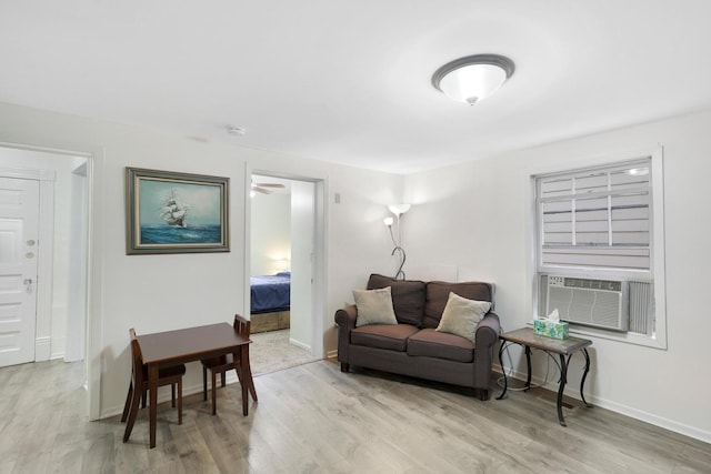 451 Taylor St NE, Minneapolis, MN 55413 - living area featuring light wood-style flooring and cooling unit