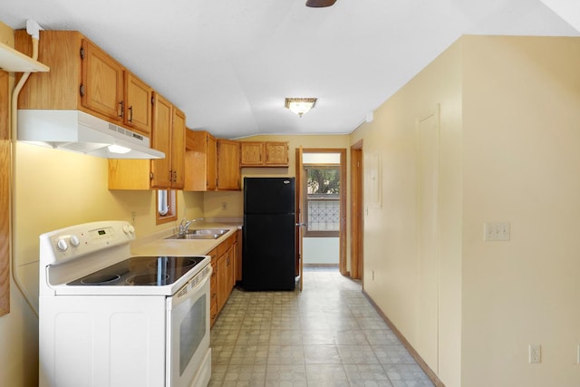 451 Taylor St NE, Minneapolis, MN 55413 - kitchen featuring white range with electric cooktop, freestanding refrigerator, under cabinet range hood, light countertops, and vaulted ceiling