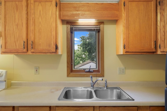 451 Taylor St NE, Minneapolis, MN 55413 - kitchen featuring light countertops and brown cabinets