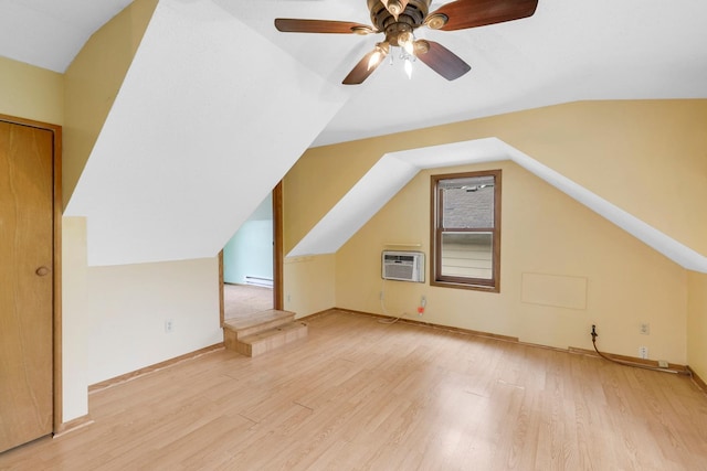 451 Taylor St NE, Minneapolis, MN 55413 - additional living space featuring an AC wall unit, a baseboard heating unit, light wood-type flooring, vaulted ceiling, and ceiling fan