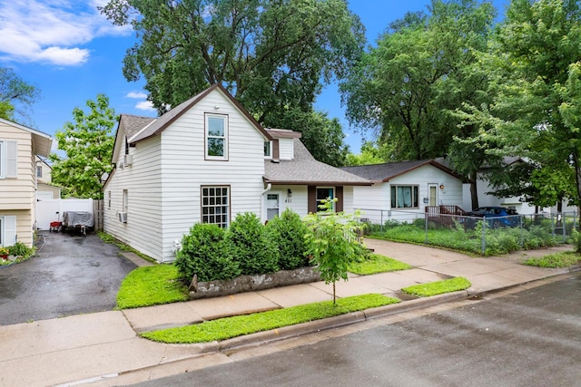 451 Taylor St NE, Minneapolis, MN 55413 - traditional-style home featuring a shingled roof and asphalt driveway