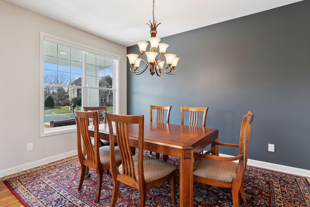 3626 Springwood Ct, Eagan, MN 55123 - dining room with a chandelier, baseboards, and wood finished floors