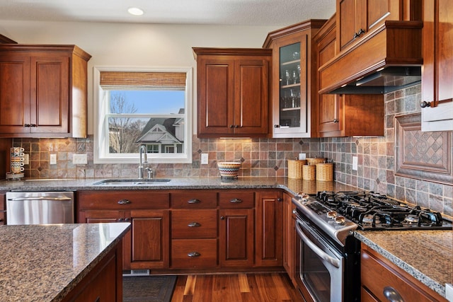 3626 Springwood Ct, Eagan, MN 55123 - kitchen with stainless steel appliances, a sink, custom range hood, wood finished floors, and dark stone counters