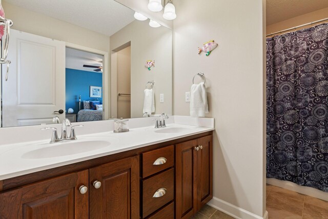3626 Springwood Ct, Eagan, MN 55123 - full bathroom with tile patterned floors, ensuite bathroom, double vanity, and a shower with curtain