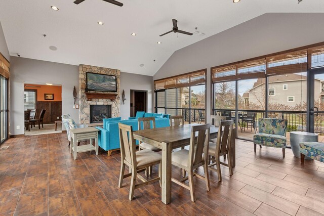 3626 Springwood Ct, Eagan, MN 55123 - dining space featuring ceiling fan, a stone fireplace, healthy amount of natural light, recessed lighting, and high vaulted ceiling