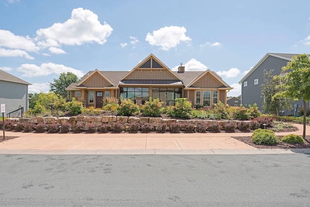3626 Springwood Ct, Eagan, MN 55123 - craftsman house with board and batten siding and a chimney