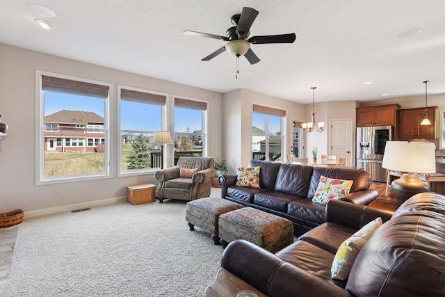 3626 Springwood Ct, Eagan, MN 55123 - carpeted living area with a chandelier, baseboards, ceiling fan, and recessed lighting