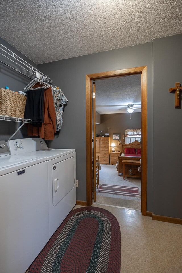 2475 44th St SW, Pine River, MN 56474 - laundry area with a textured ceiling, washer and dryer, laundry area, and baseboards