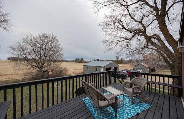 2475 44th St SW, Pine River, MN 56474 - deck featuring a rural view, an outdoor structure, and a lawn