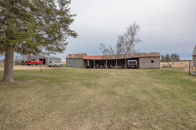 2475 44th St SW, Pine River, MN 56474 - ranch-style home featuring a pole building, a front yard, and an outbuilding