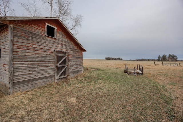 2475 44th St SW, Pine River, MN 56474 - view of yard featuring a rural view, a barn, and an outbuilding