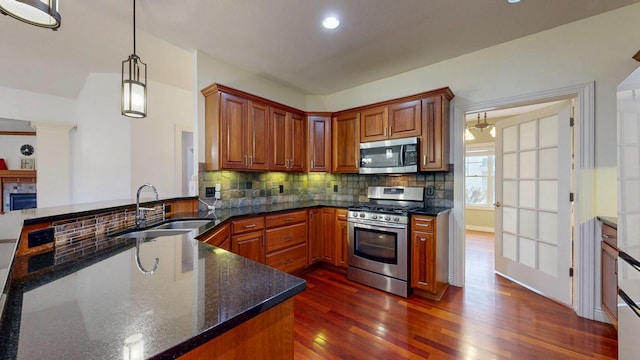 1213 Grey Fox Ave SW, Rochester, MN 55902 - kitchen featuring stainless steel appliances, a sink, dark wood-style floors, backsplash, and recessed lighting