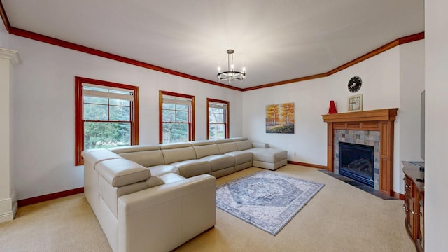 1213 Grey Fox Ave SW, Rochester, MN 55902 - living area with carpet flooring, a tiled fireplace, a chandelier, ornamental molding, and baseboards