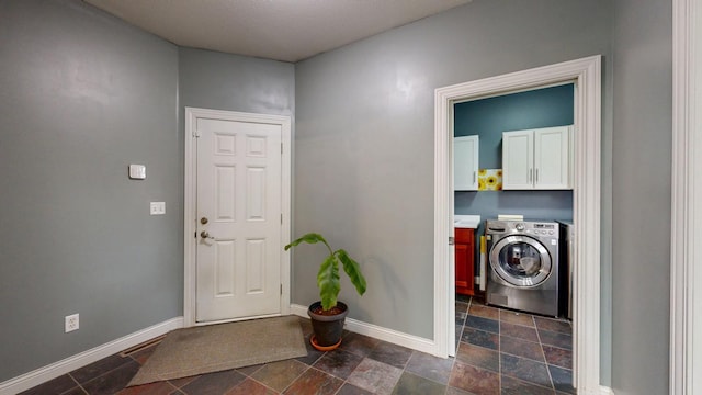 1213 Grey Fox Ave SW, Rochester, MN 55902 - laundry room with cabinet space, washer and clothes dryer, baseboards, and dark stone finish floors