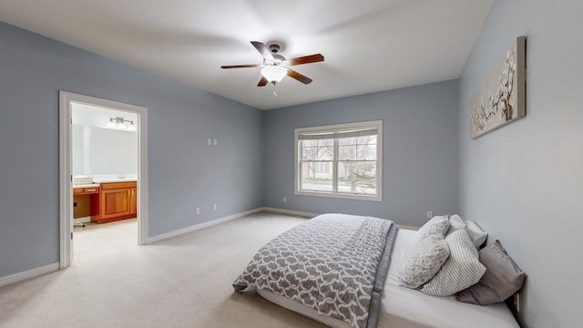 1213 Grey Fox Ave SW, Rochester, MN 55902 - bedroom featuring light colored carpet, baseboards, connected bathroom, and a ceiling fan