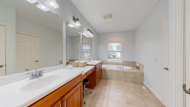 1213 Grey Fox Ave SW, Rochester, MN 55902 - full bath with a garden tub, tile patterned floors, and vanity