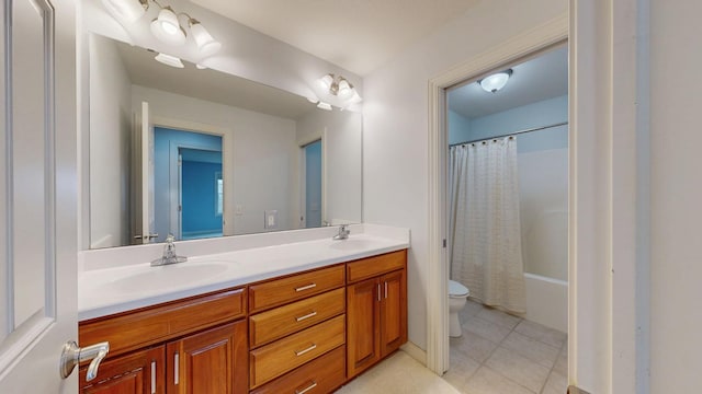 1213 Grey Fox Ave SW, Rochester, MN 55902 - full bathroom featuring toilet, double vanity, and tile patterned flooring