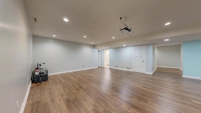 1213 Grey Fox Ave SW, Rochester, MN 55902 - empty room featuring recessed lighting, wood finished floors, and baseboards