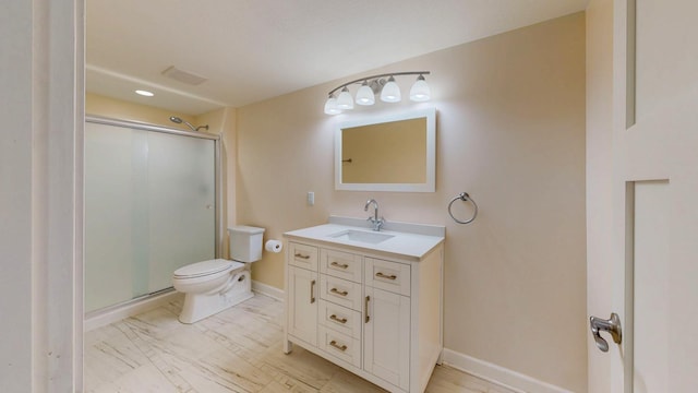 1213 Grey Fox Ave SW, Rochester, MN 55902 - full bathroom with toilet, a stall shower, vanity, baseboards, and marble look tiles