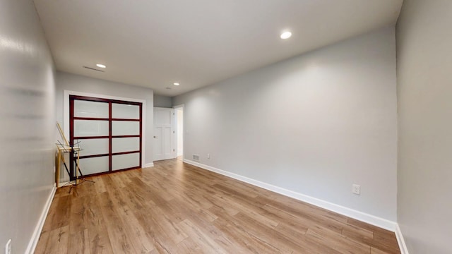 1213 Grey Fox Ave SW, Rochester, MN 55902 - unfurnished room featuring baseboards, light wood-type flooring, and recessed lighting