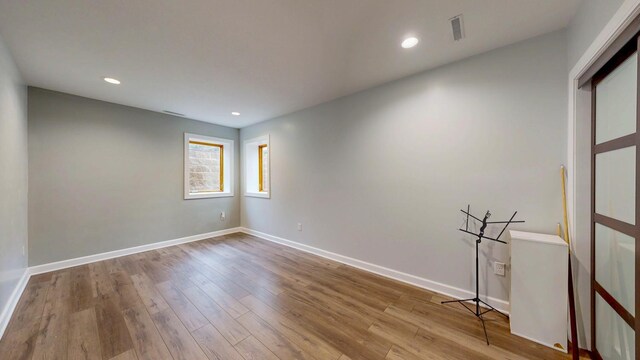 1213 Grey Fox Ave SW, Rochester, MN 55902 - empty room featuring wood finished floors, recessed lighting, and baseboards