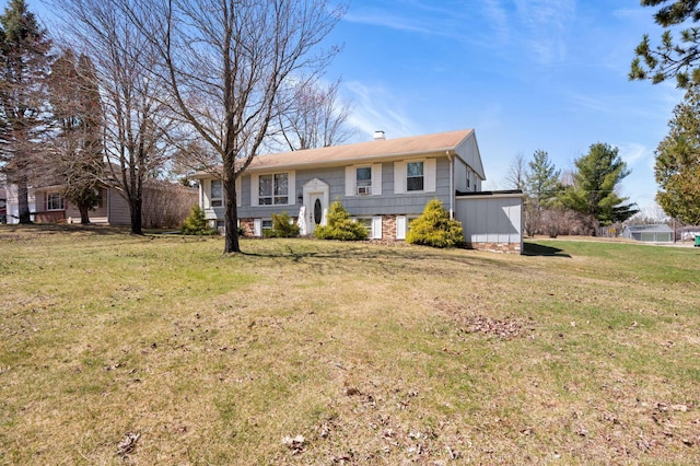 1601 5th Ave, Grand Rapids, MN 55744 - raised ranch featuring a chimney and a front yard