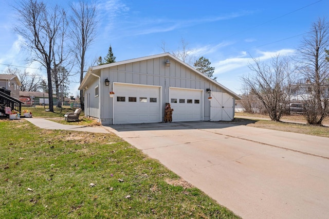 1601 5th Ave, Grand Rapids, MN 55744 - view of property exterior with driveway, a yard, and board and batten siding