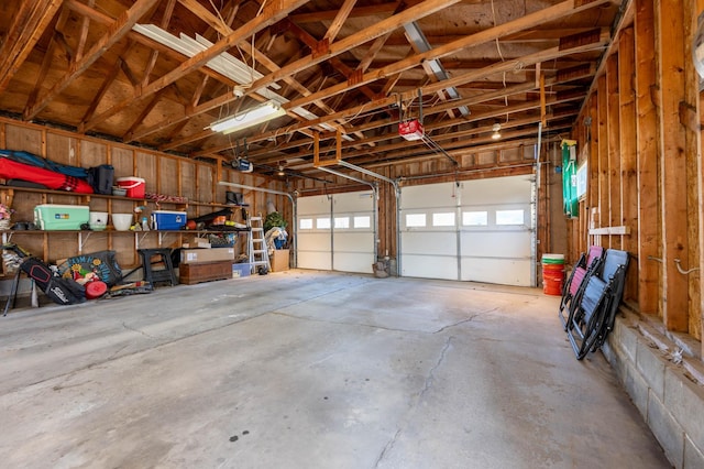 1601 5th Ave, Grand Rapids, MN 55744 - garage featuring a garage door opener
