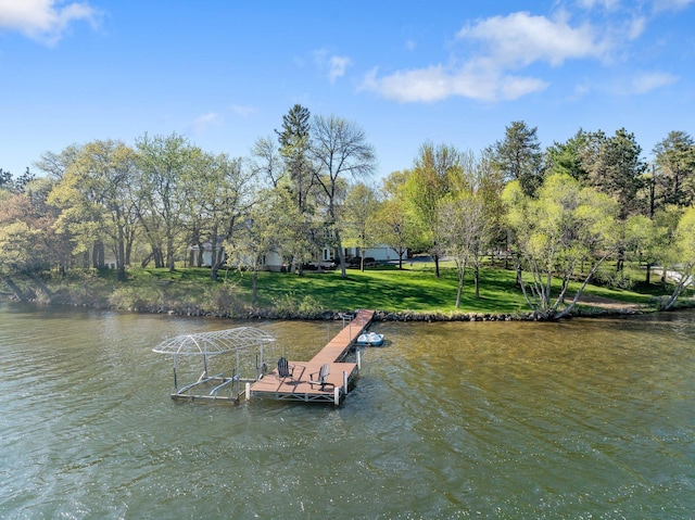 dock with a water view and a lawn